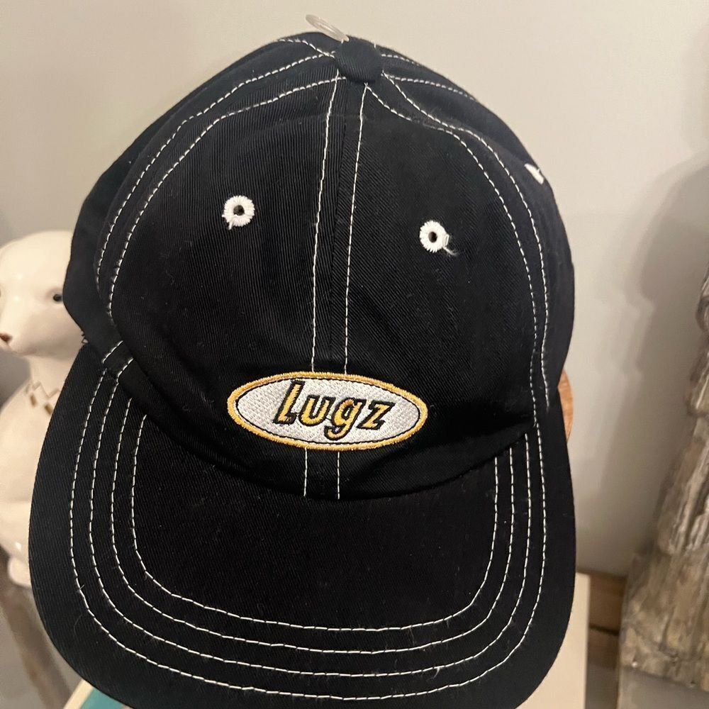 Lugz vintage pinstripe Black Hat with White Accents. Adjustable. NWOT.